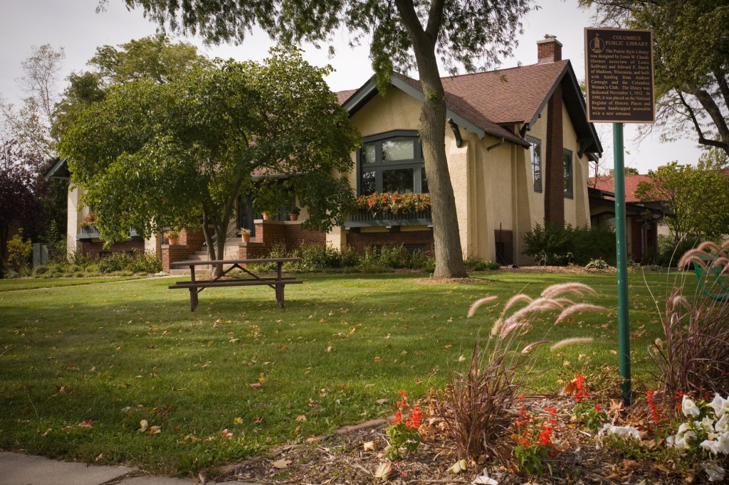 What's nearby the HA Whitney Inn B&B Columbus, Wisconsin? The Columbus Public Library was designed by Louis W. Claude (former associate of Louis Sullivan). Funding was from Andrew Carnegie & the Columbus Women's Club.